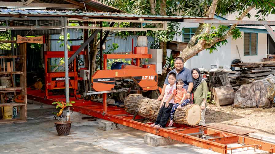 Wood-Mizer customer Mohd Nazmie with his family and the LT15 sawmill.